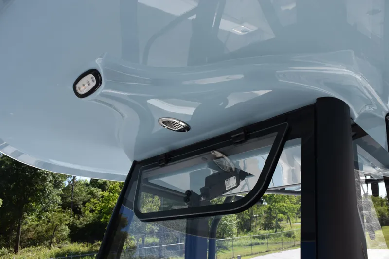 Slide: The Image of 2026 Sea Hunt Ultra 275 SE boat canopy with integrated lighting and ventilation. - 13