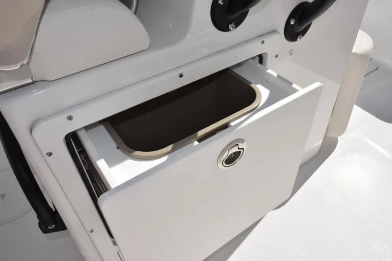 Slide: The Image of Open storage compartment on 2026 Sea Hunt Ultra 275 SE boat. - 20