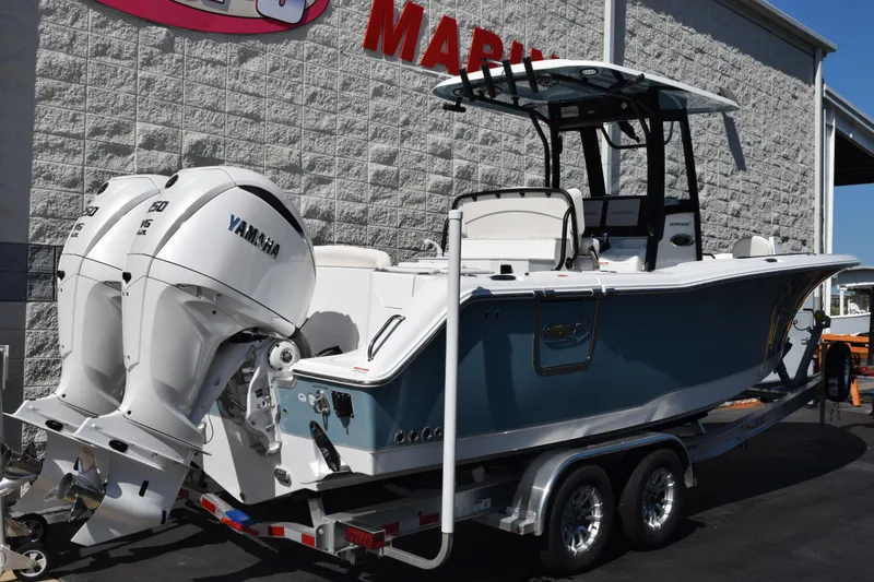 Slide: The Image of 2026 Sea Hunt Ultra 275 SE boat with twin Yamaha engines on a trailer. - 4