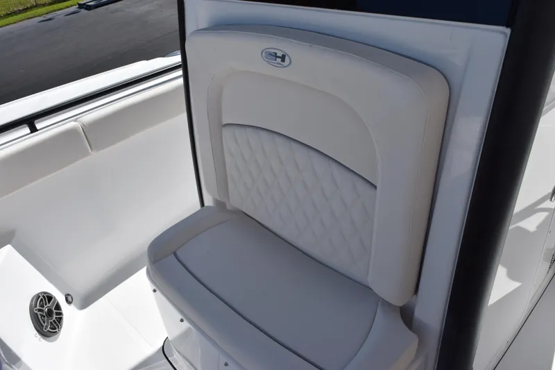 Slide: The Image of 2026 Sea Hunt Ultra 275 SE boat seat with quilted design and speaker detail. - 12