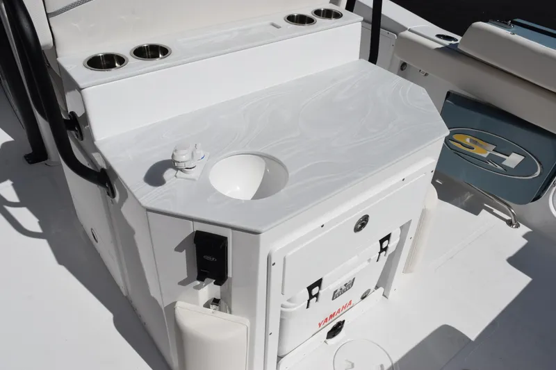 Slide: The Image of 2026 Sea Hunt Ultra 275 SE boat interior with sink and storage area. - 7