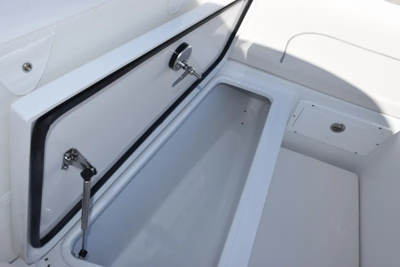 Slide: The Image of Open storage compartment on 2026 Sea Hunt Ultra 275 SE boat. - 17