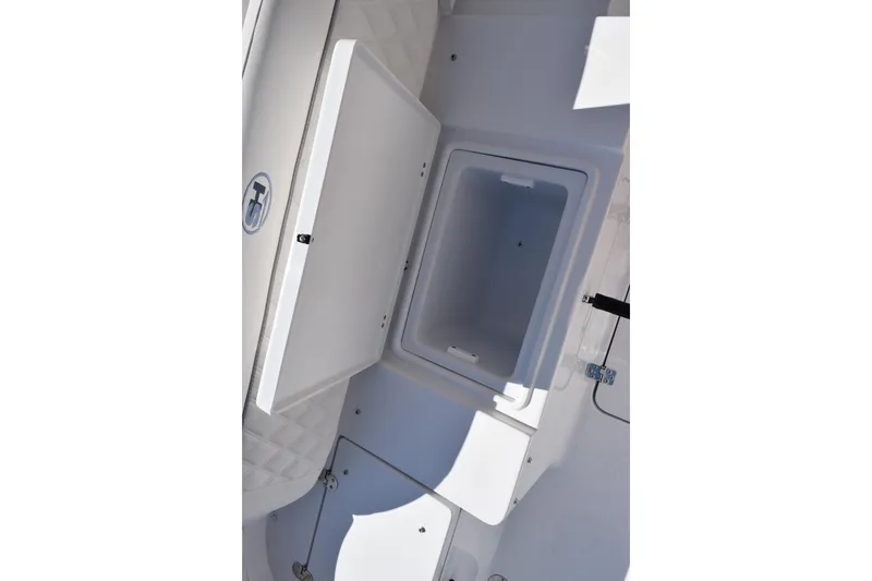 Slide: The Image of Open storage compartment on 2026 Sea Hunt Ultra 275 SE boat. - 25