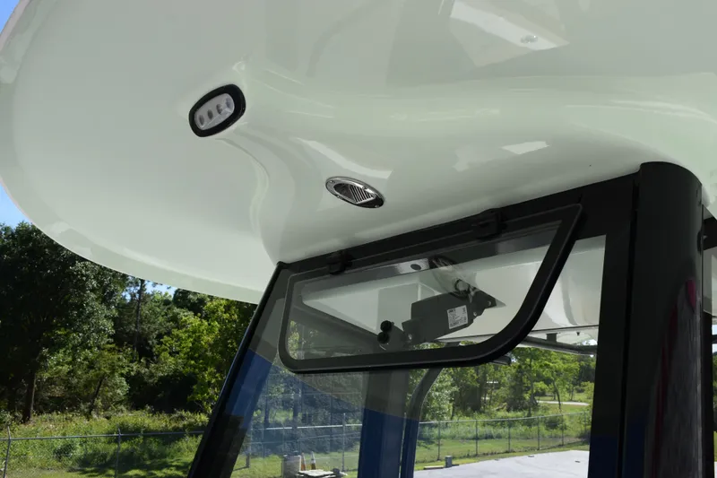 Slide: The Image of 2026 Sea Hunt Ultra 265 SE boat canopy and window detail, showcasing sleek design and modern features. - 14