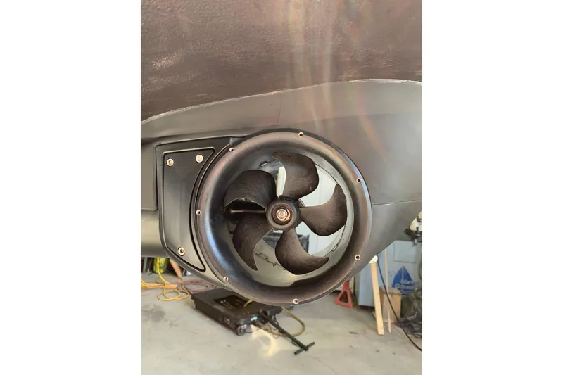 Slide: The Image of 2023 Beneteau Oceanis 34.1 bow thruster detail in a workshop setting. - 12