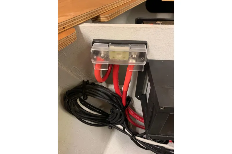 Slide: The Image of Electrical wiring and fuse box inside 2023 Beneteau Oceanis 34.1 yacht. - 15