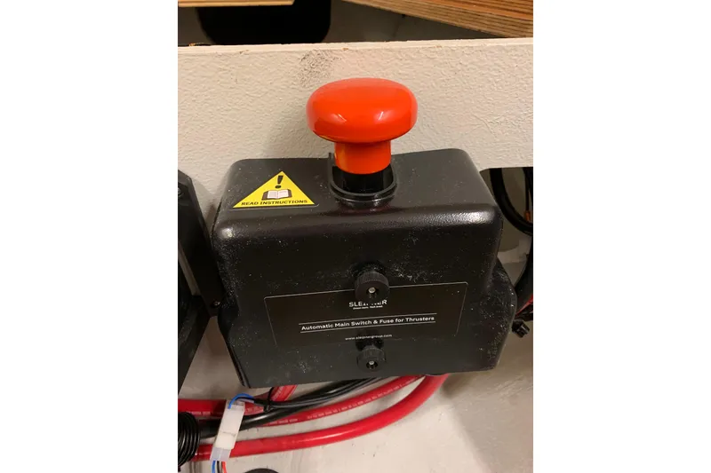 Slide: The Image of Automatic main switch with red button on 2023 Beneteau Oceanis 34.1 yacht. - 16