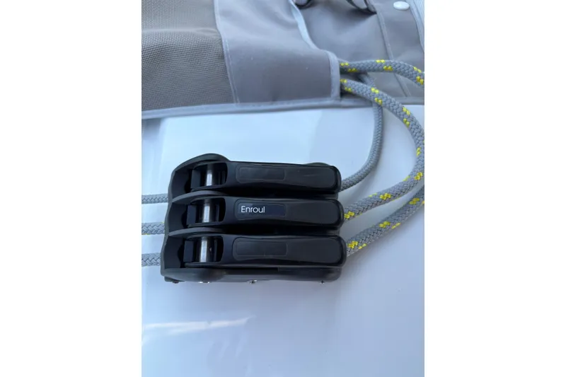 Slide: The Image of Close-up of rope clutches on a 2023 Beneteau Oceanis 34.1 sailboat. - 23