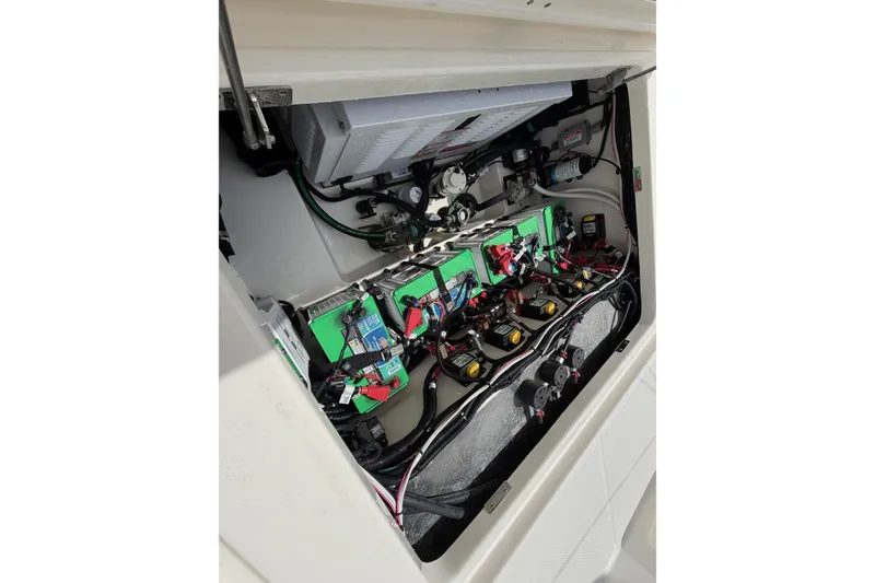 Slide: The Image of Electrical system of 2023 Boston Whaler 325 Conquest boat, showcasing batteries and wiring. - 10