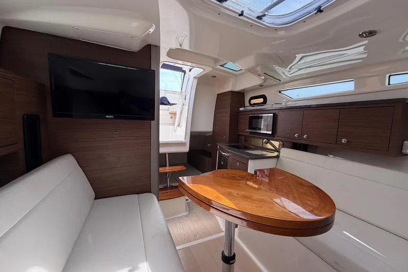 Slide: The Image of Luxurious interior of 2023 Boston Whaler 325 Conquest with modern amenities and sleek design. - 29