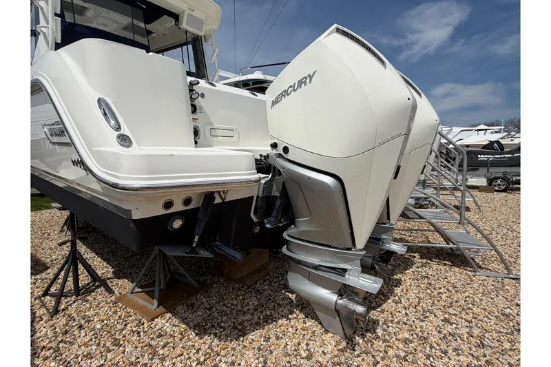 Slide: The Image of 2023 Boston Whaler 325 Conquest with dual Mercury outboard engines on display. - 3