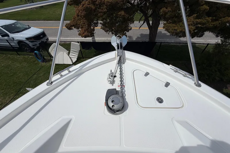 Slide: The Image of Bow view of 2023 Boston Whaler 325 Conquest, featuring anchor and deck details. - 34