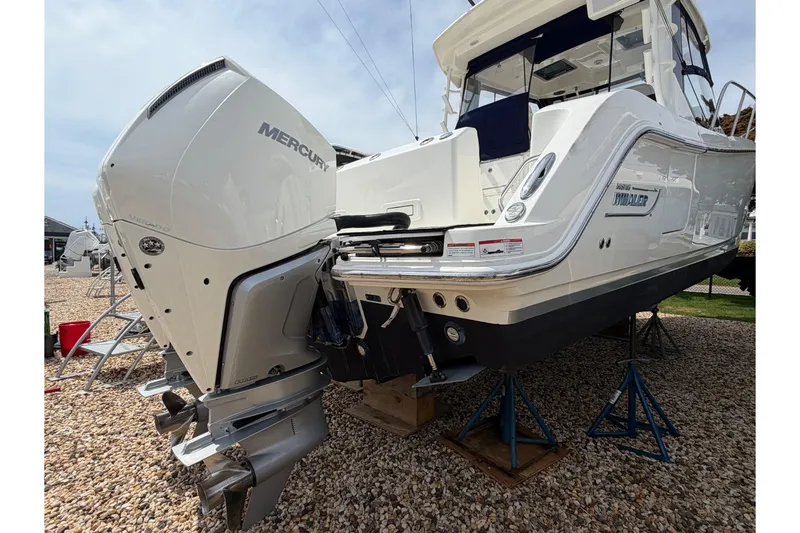 Slide: The Image of 2023 Boston Whaler 325 Conquest with Mercury outboard engines on display. - 5