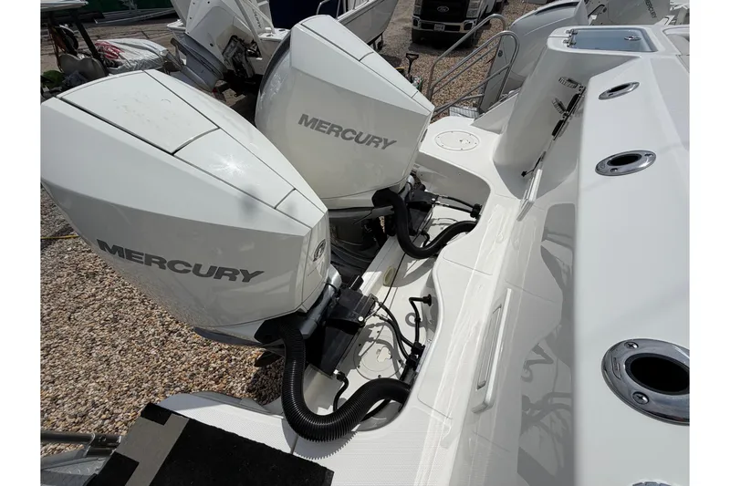 Slide: The Image of 2023 Boston Whaler 325 Conquest with dual Mercury outboard engines, showcasing sleek design. - 6