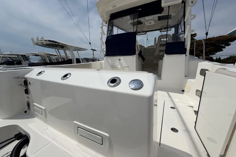 Slide: The Image of 2023 Boston Whaler 325 Conquest boat interior, showcasing sleek design and modern features. - 8