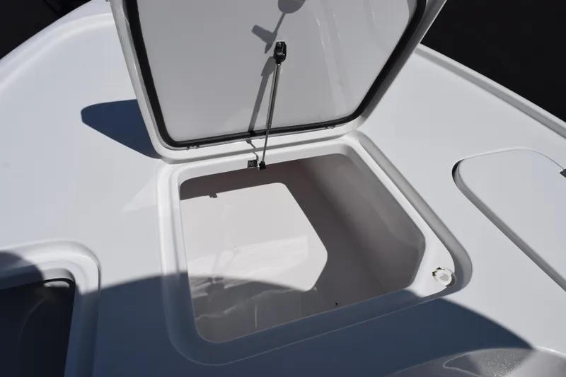Slide: The Image of Open storage compartment on 2026 Sea Hunt BX 22 BR boat. - 14