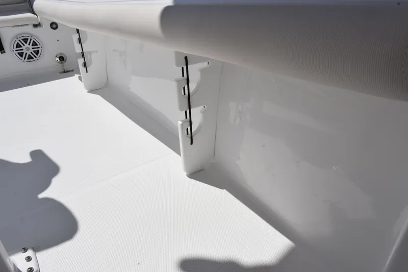 Slide: The Image of 2026 Sea Hunt BX 22 BR boat interior, featuring white seating and storage compartments. - 18