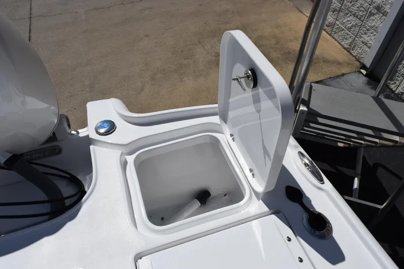 Slide: The Image of 2026 Sea Hunt BX 22 BR boat storage compartment with open lid. - 21