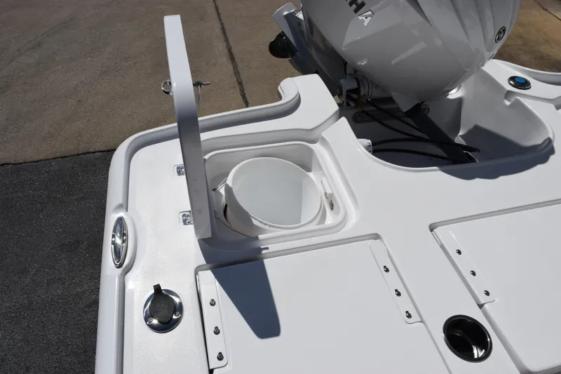 Slide: The Image of 2026 Sea Hunt BX 22 BR boat deck with storage compartment and Yamaha engine. - 22