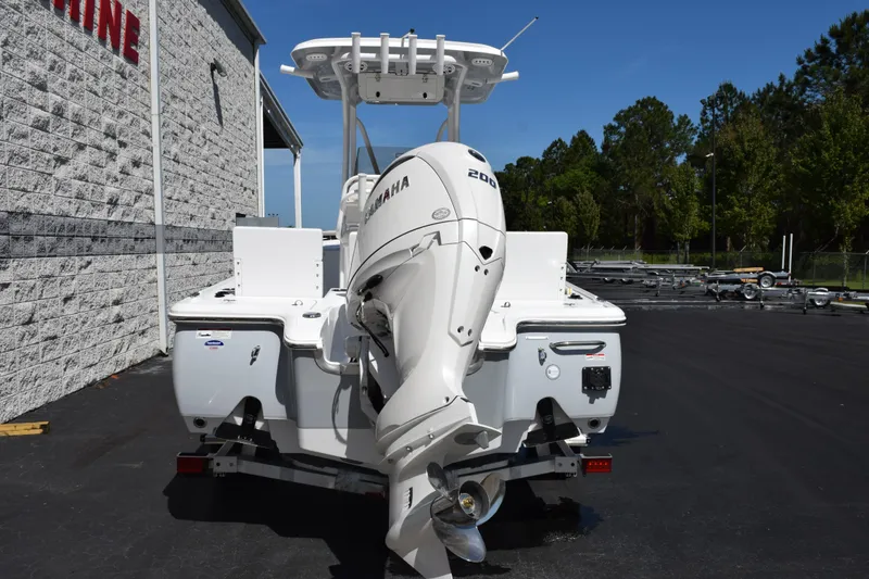 Slide: The Image of 2026 Sea Hunt BX 22 BR boat with Yamaha engine, parked outdoors. - 5