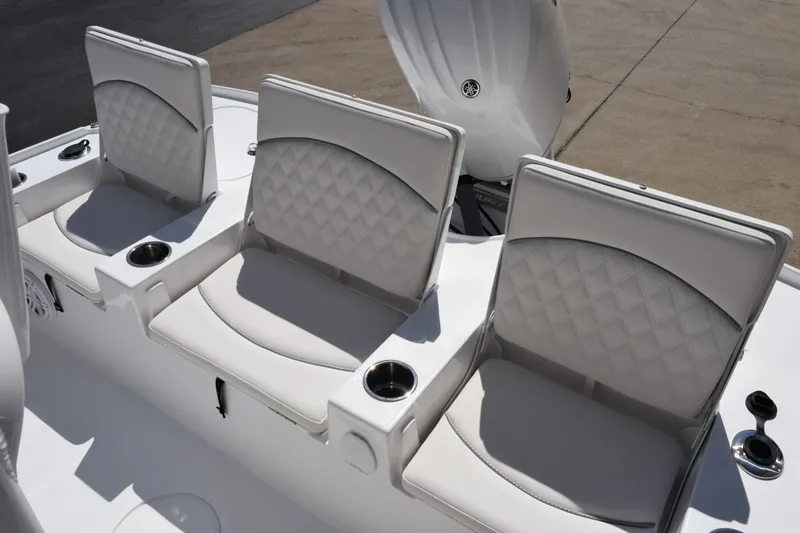 Slide: The Image of 2026 Sea Hunt BX 22 BR boat seats with diamond-pattern upholstery and integrated cup holders. - 8