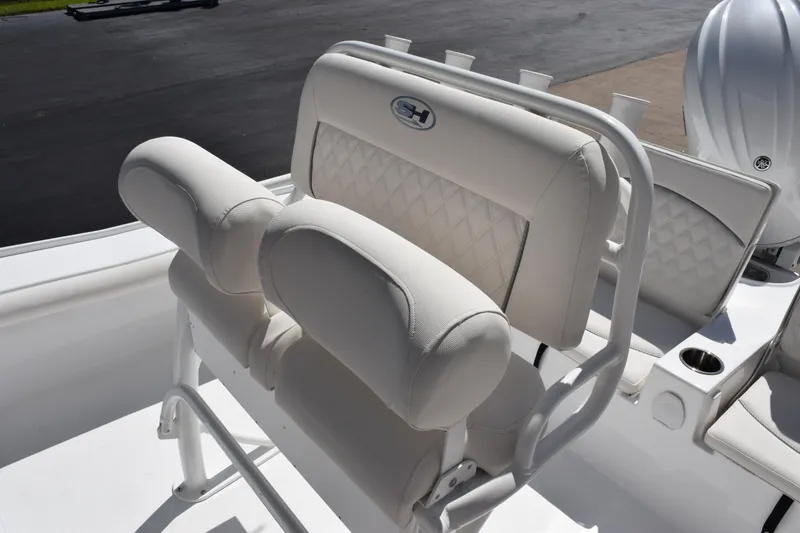 Slide: The Image of 2026 Sea Hunt BX 22 BR boat with cushioned seating and rod holders. - 9