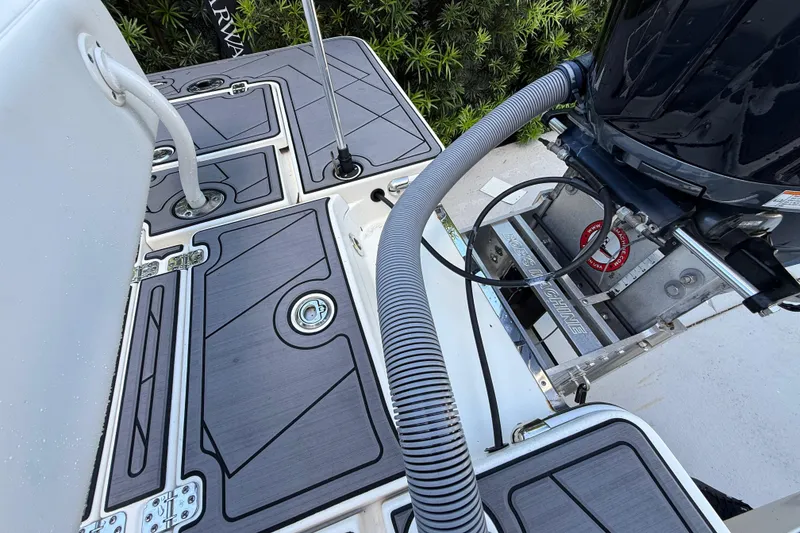 Slide: The Image of 2023 ShearWater x22 boat deck with motor and sleek design elements. - 19