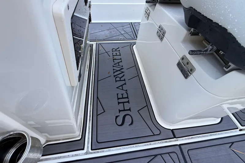 Slide: The Image of 2023 ShearWater x22 boat interior with branded flooring and storage compartments. - 24