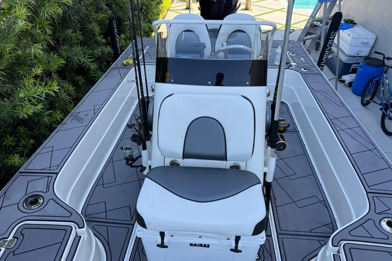Slide: The Image of 2023 ShearWater x22 boat interior with fishing rods and seating. - 27