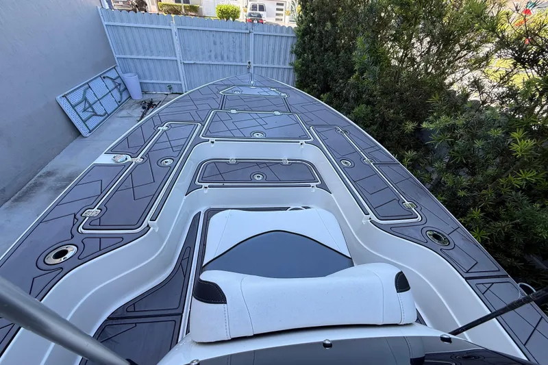 Slide: The Image of 2023 ShearWater x22 boat deck with sleek design and modern seating. - 28