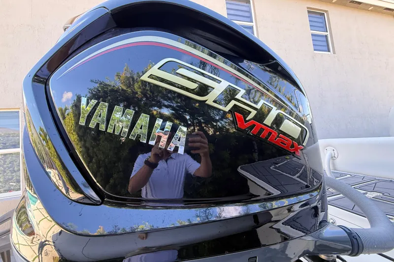 Slide: The Image of Yamaha SHO VMAX engine on 2023 ShearWater x22 boat, reflecting surroundings. - 5