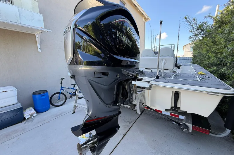 Slide: The Image of 2023 ShearWater x22 boat with Yamaha outboard motor on trailer. - 6