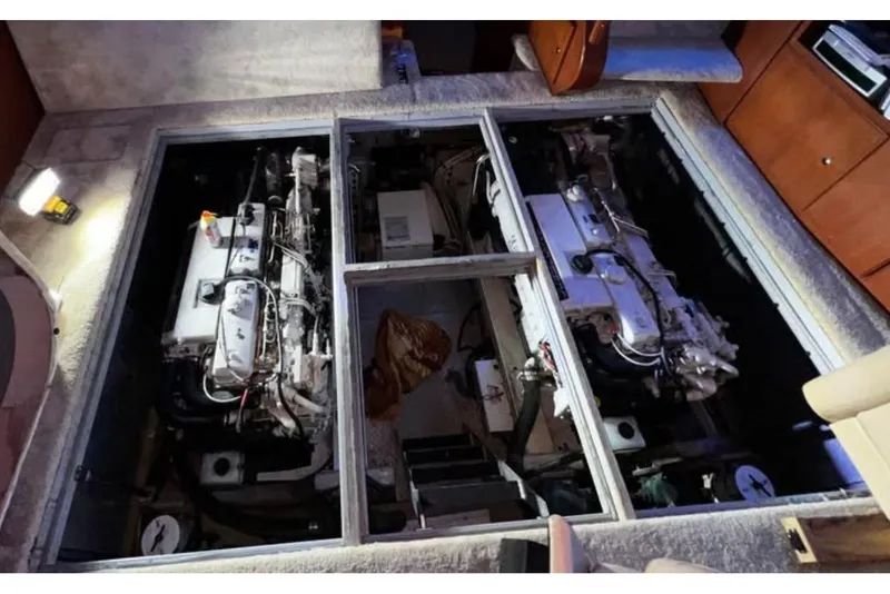 Slide: The Image of Engine room of a 2004 Silverton 43 Motor Yacht, showcasing dual engines. - 12