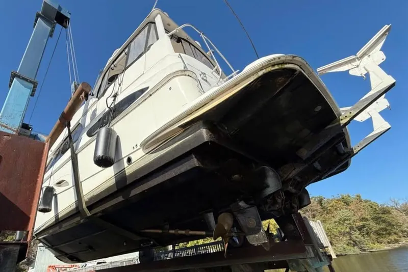 Slide: The Image of 2004 Silverton 43 Motor Yacht being lifted from water by crane. - 5