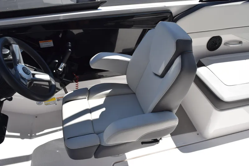 Slide: The Image of 2024 Yamaha Boats AR250 captain's seat and steering wheel, showcasing modern design and comfort. - 12