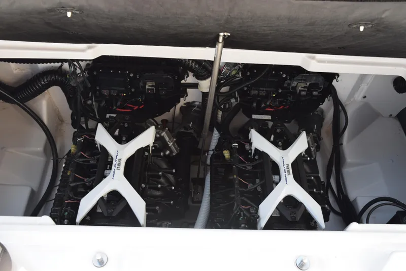 Slide: The Image of 2024 Yamaha AR250 boat engine compartment with dual engines and visible components. - 21