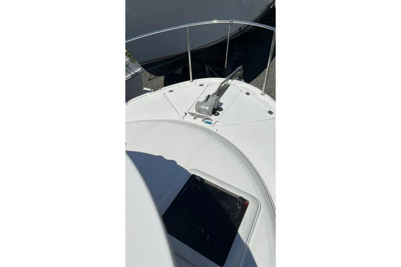 Slide: The Image of 2018 Ranger Tugs R-23 boat deck with anchor and railing in sunlight. - 10