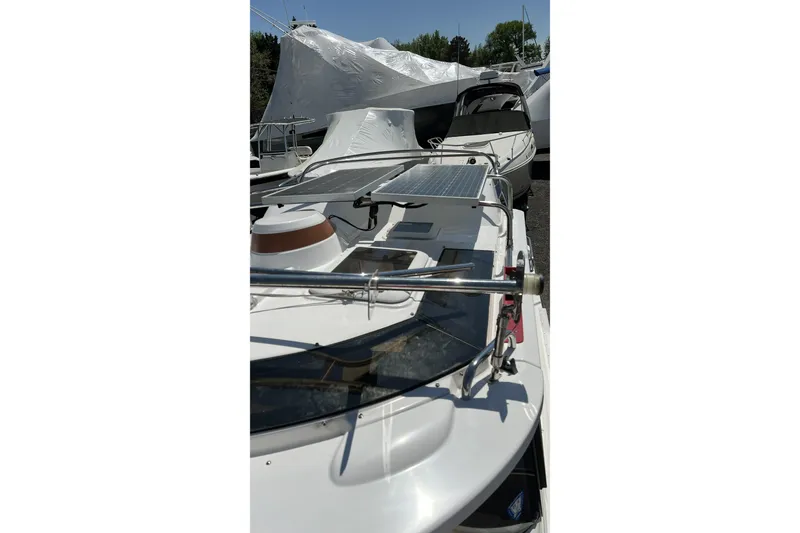 Slide: The Image of 2018 Ranger Tugs R-23 boat with solar panel, docked outdoors. - 12