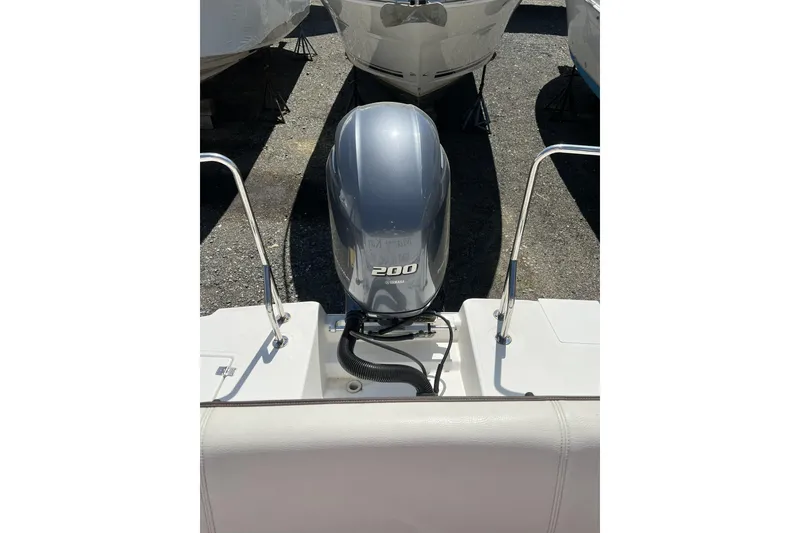 Slide: The Image of 2018 Ranger Tugs R-23 boat with a 200 horsepower outboard motor. - 2