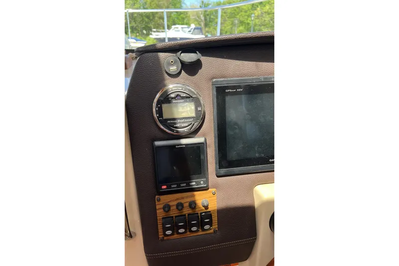 Slide: The Image of Dashboard of a 2018 Ranger Tugs R-23 boat with navigation instruments. - 21