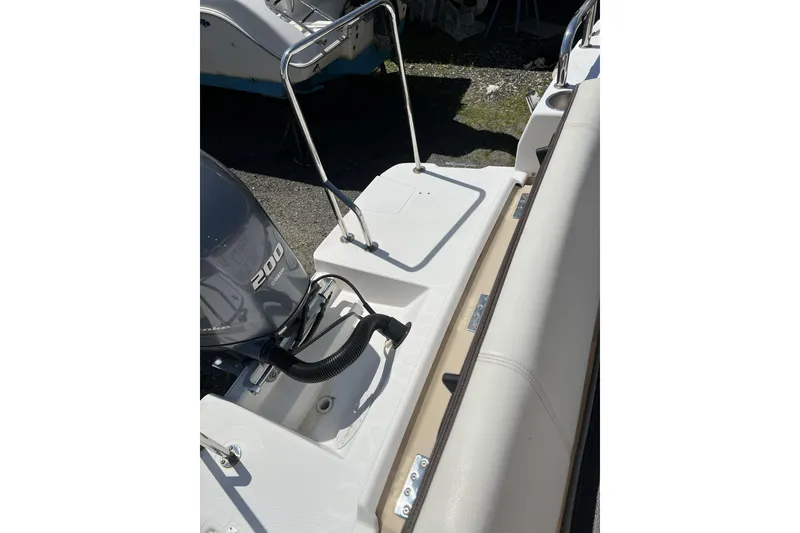 Slide: The Image of 2018 Ranger Tugs R-23 boat with 200 horsepower engine, featuring a sleek deck design. - 3