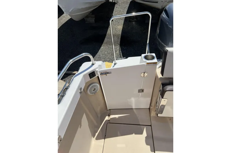 Slide: The Image of 2018 Ranger Tugs R-23 boat deck with open gate and cup holder. - 4