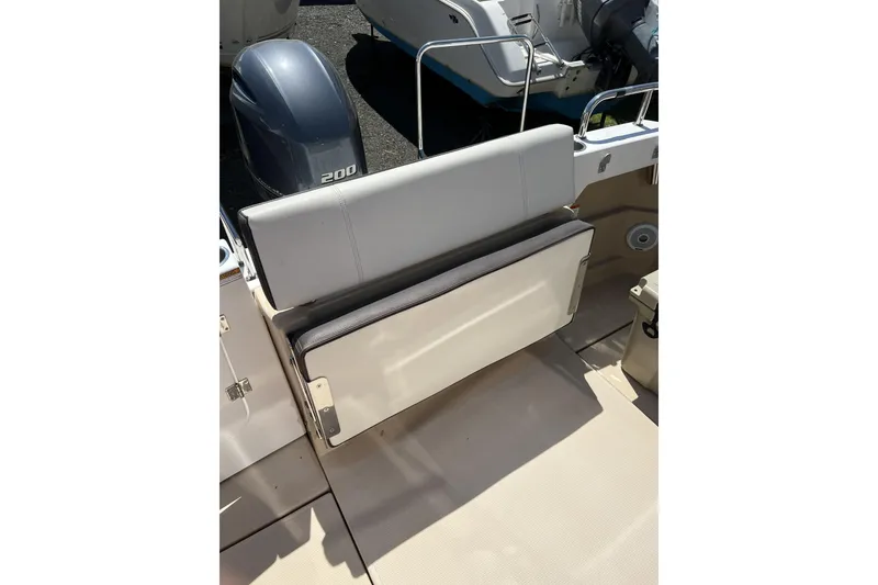 Slide: The Image of 2018 Ranger Tugs R-23 boat seat and engine detail, showcasing sleek design and functionality. - 5