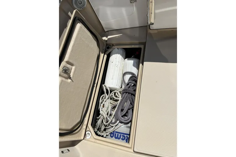 Slide: The Image of Storage compartment on 2018 Ranger Tugs R-23 boat with ropes and equipment. - 7