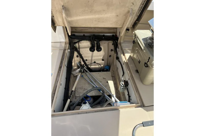 Slide: The Image of Open engine compartment of 2018 Ranger Tugs R-23 boat, showing internal components and wiring. - 8