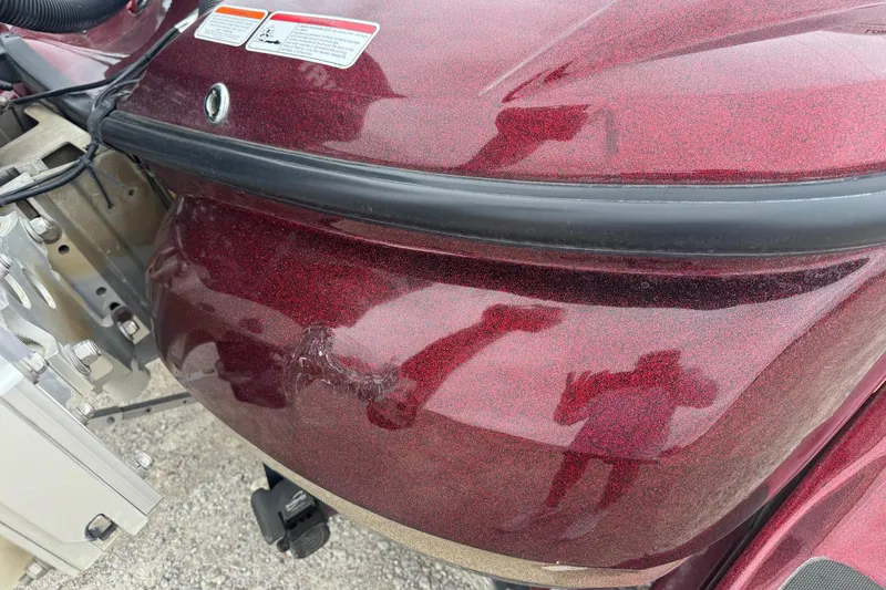 Slide: The Image of 2009 Nitro Z-9 CDC boat with visible hull damage and reflective surface. - 14