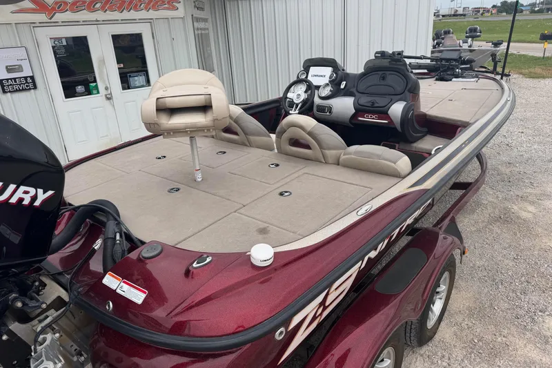Slide: The Image of 2009 Nitro Z-9 CDC boat with Mercury engine, parked outside a service shop. - 8