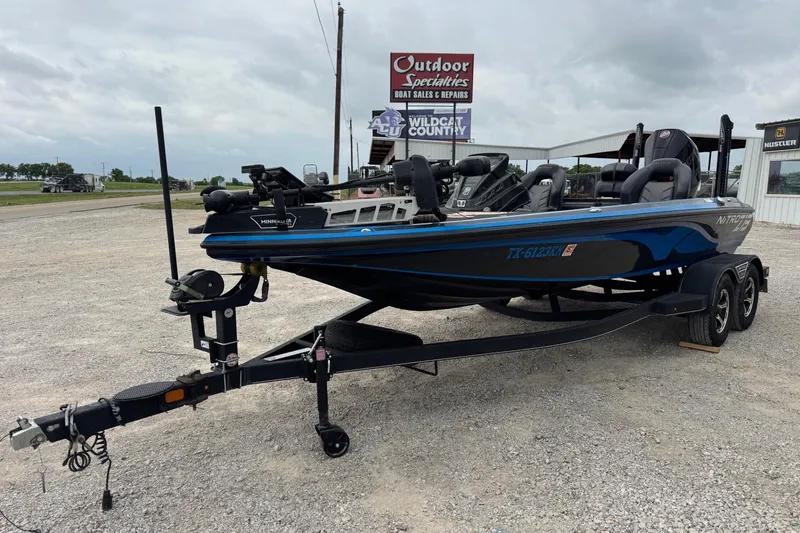 Slide: The Image of 2022 Nitro Z19 boat on trailer at Outdoor Specialties dealership. - 9