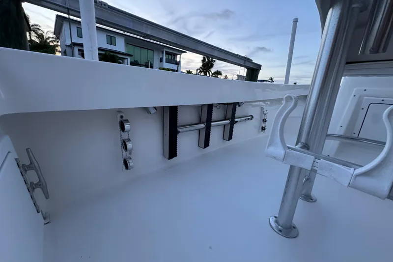 Slide: The Image of 2004 Regulator 21 Forward Seating boat interior with rod holders and cleats. - 7