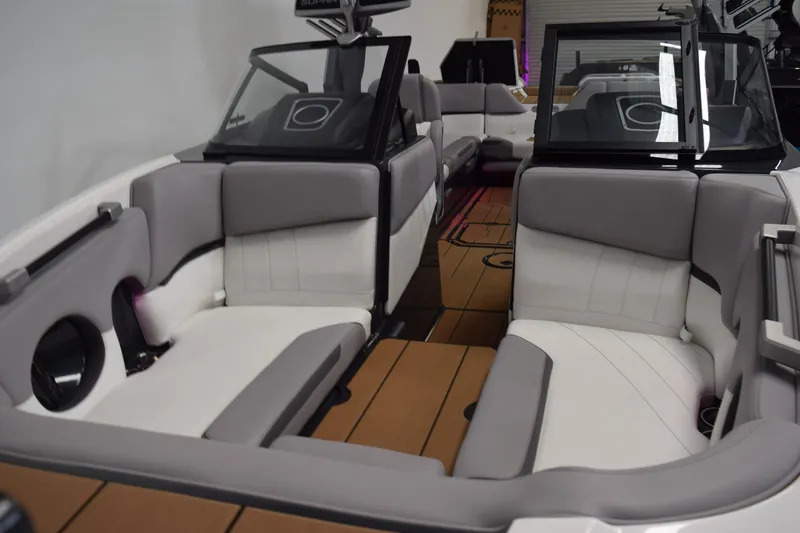 Slide: The Image of Interior of a 2021 Supra SE 450 boat with gray and white seating. - 14